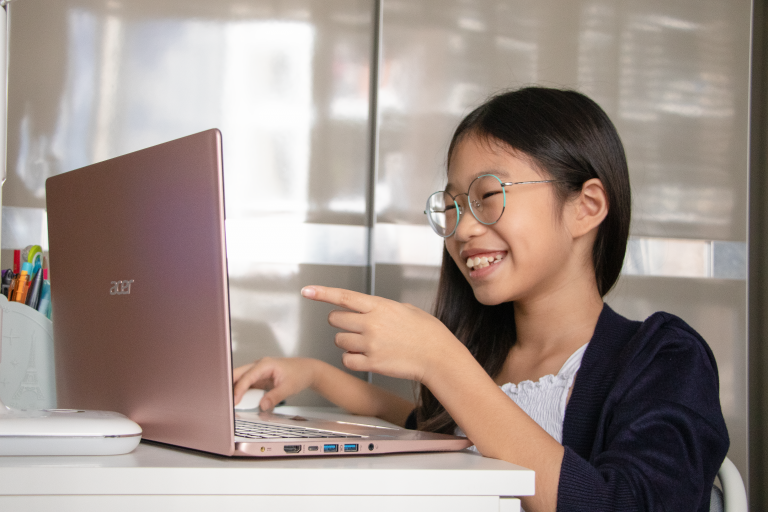 A young student working on her school work during this time of home-based learning.