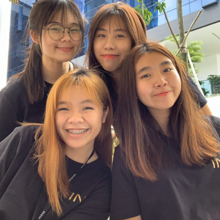 Leisure and Events Management student from Temasek Polytechnic Cynthia Ng with her fellow workers during an Earth Hour event at her workplace.