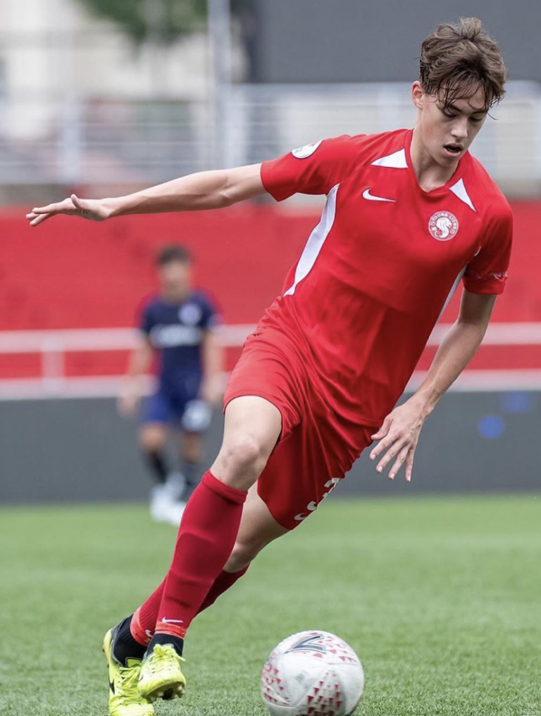 National soccer player Harhys Stewart training during his soccer practices about to aim the soccer ball into the goal