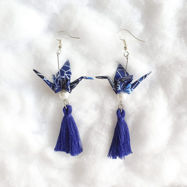 A photo of a pair of origami crane earrings