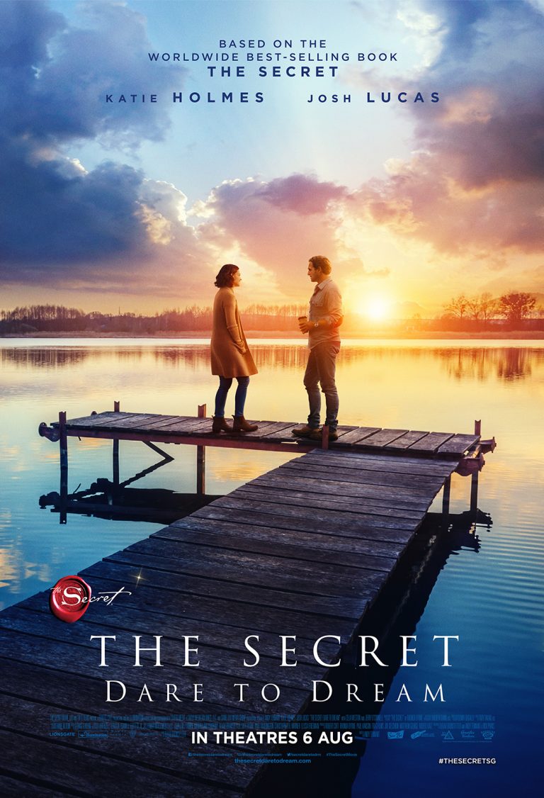 A movie poster of the 2020 film The Secret Dare To Dream, with Katie Holmes and Josh Luca standing on a wooden pier at sunset