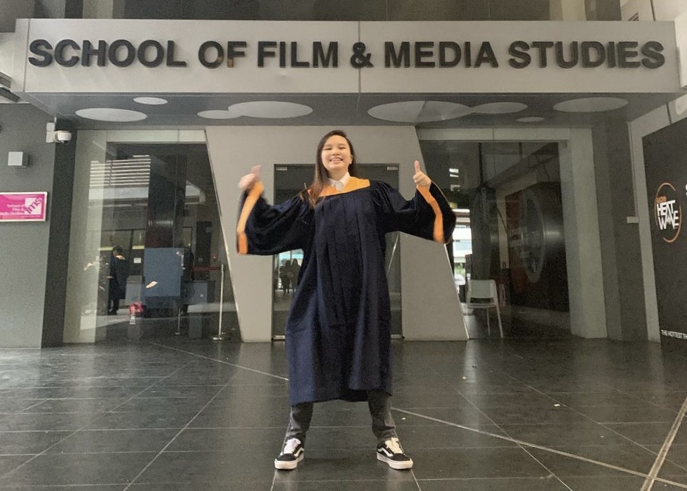 Shu Ting posing on her graduation day at Ngee Ann Polytechnic School of Film and Media Studies