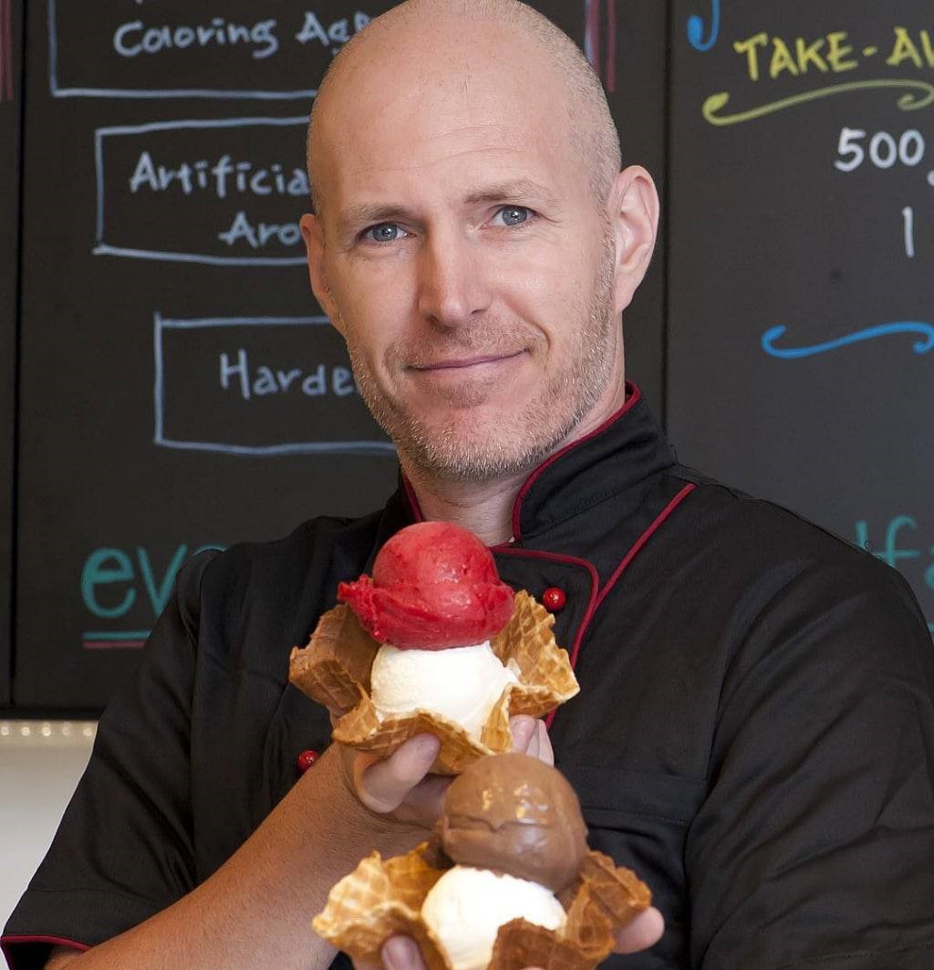 This photo shows Alfero Gelato founder Marco Alfero proudly holding up his gelatos.