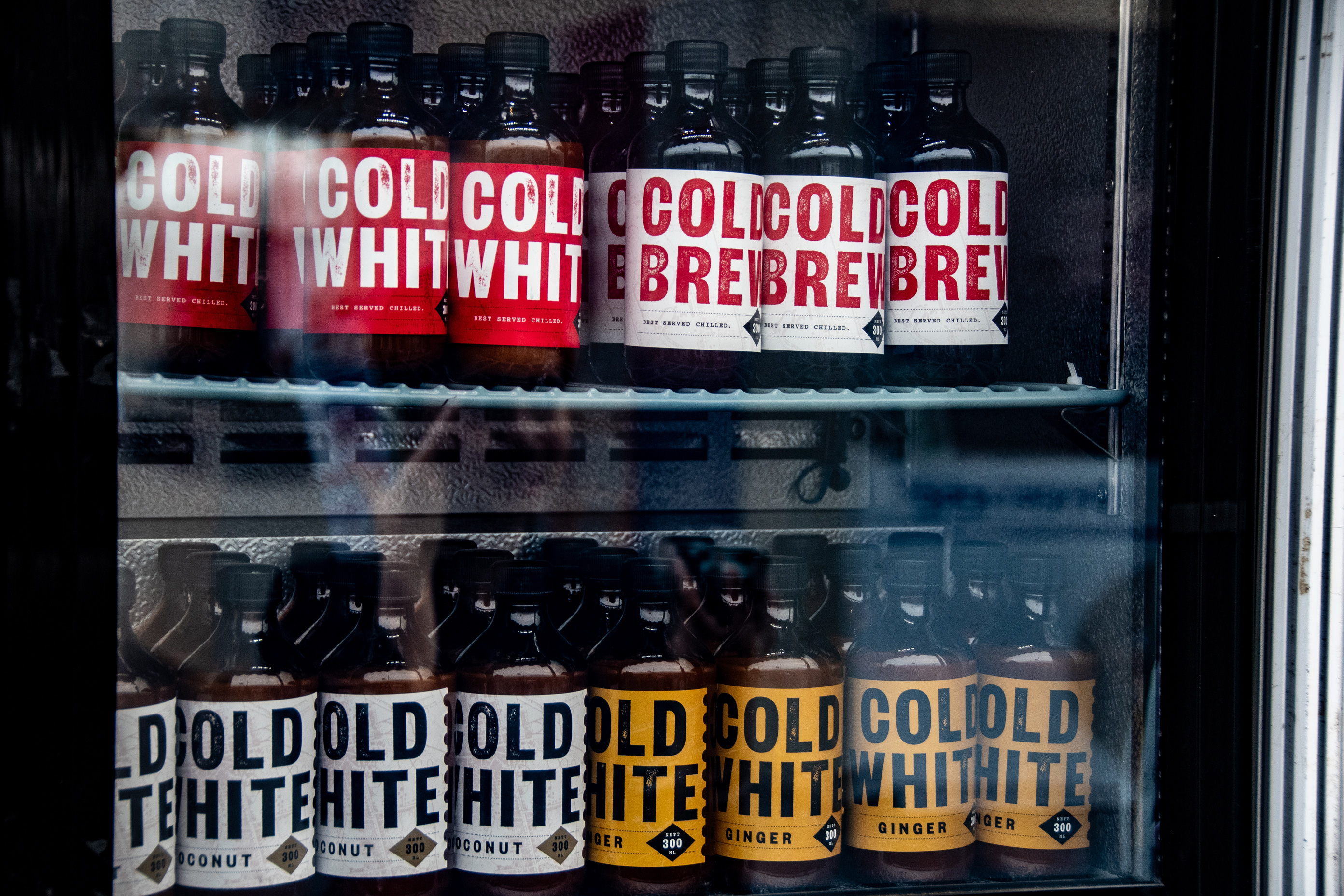 Tanamera’s bottled cold brews in their display fridge. 