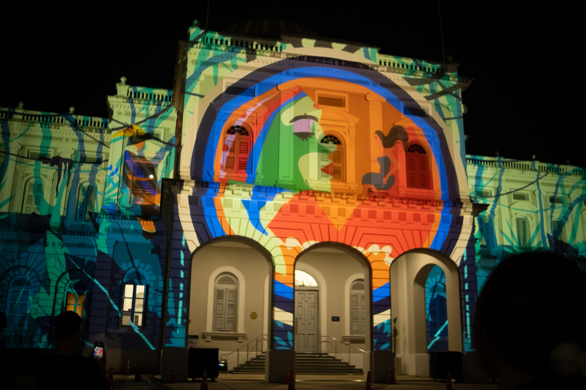The 6-minute theatrical projection mapping showcase can be observed outside the National Museum of Singapore.