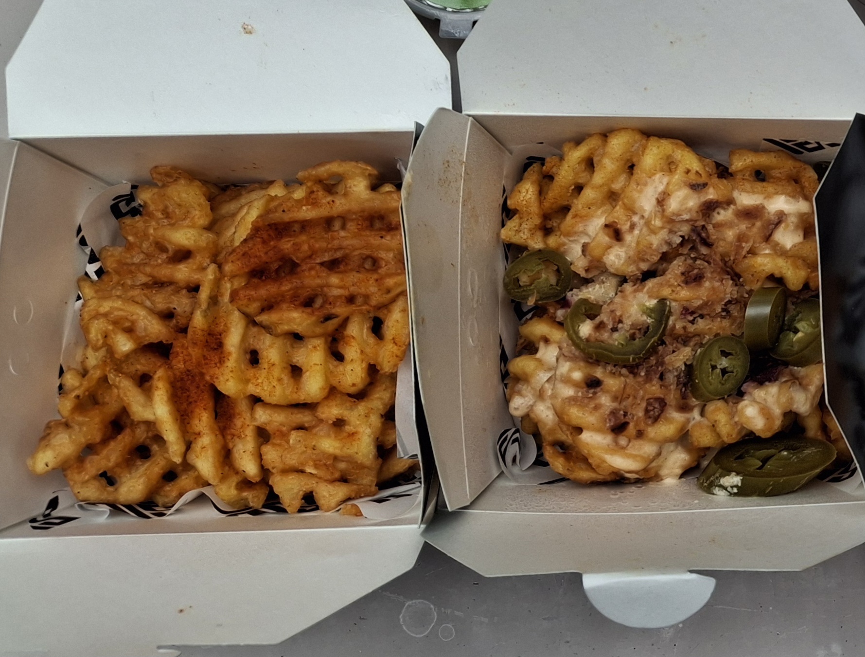 From left to right: Classic Waffle Fries, and Ultimate Loaded Waffle Fries. Photo by Geoy Kai Lin