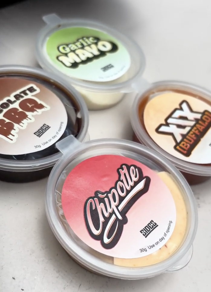 From top left to bottom right: Chocolate BBQ, Garlic Mayo, Chipotle, and XIX Buffalo sauces. Photo by Jorius Chuwa